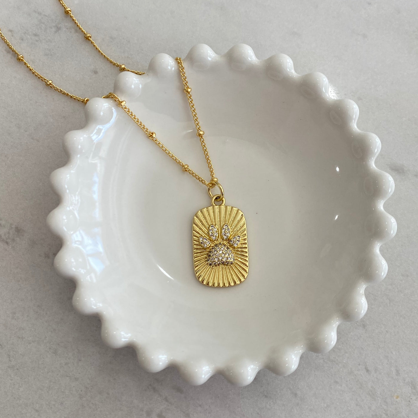 Collar Huellita con zirconias de oro laminado de 18K
