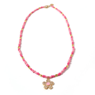 Collar Jazmin color rosa con dije de flor con cara feliz en oro laminado de 18K y zirconias - AMATINA Joyería